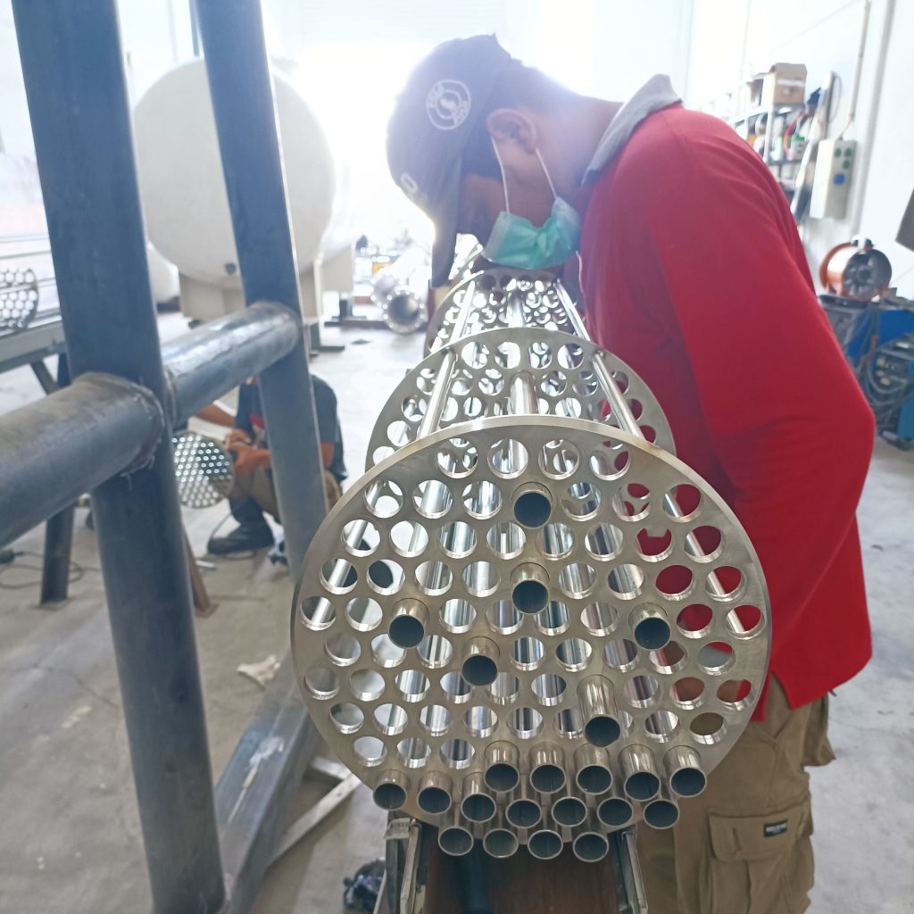 Inserting tubes into the tube bundle for a biogas cooler dehumidifier manufactured by Celsigas