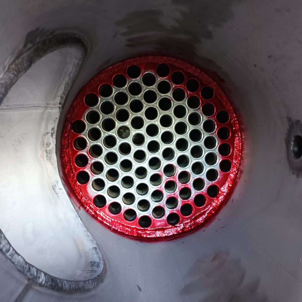 Penetrant testing of the tube plate weld to the shell inside a biogas cooler dehumidifier manufactured by Celsigas