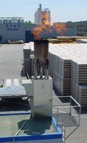 This photo shows an example for open gas flares. The flame is visible and the stack is very short.